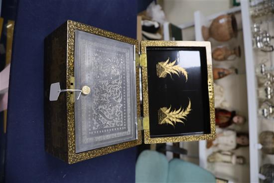 A Chinese export gilt-decorated black lacquer tea caddy, 19th century, W. 28cm